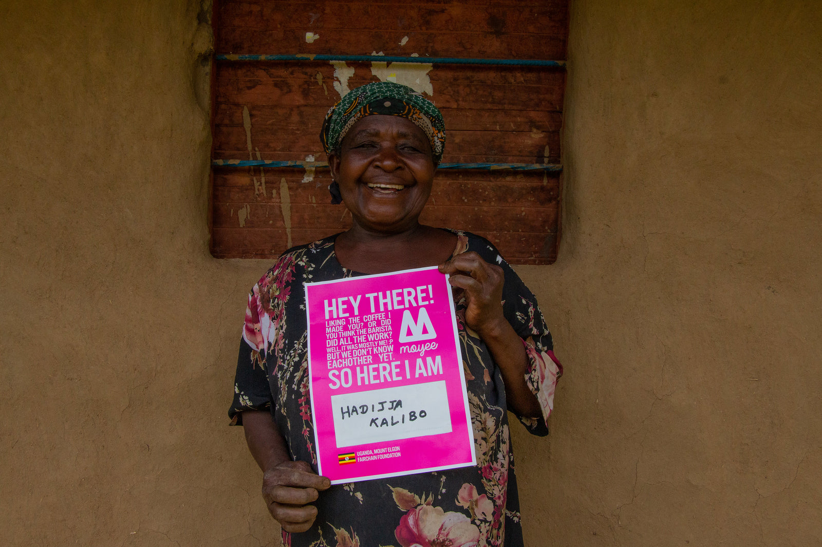 Woman holding a Moyee Sign 